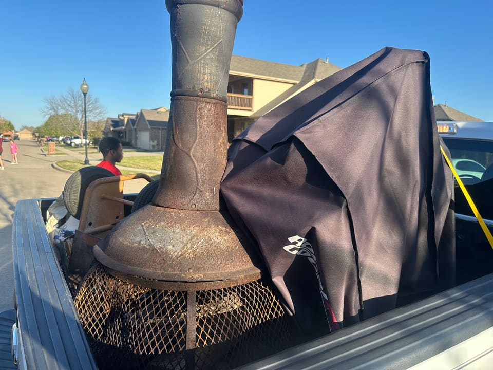 Residential junk removal with FE Logistics truck in Dallas-Fort Worth